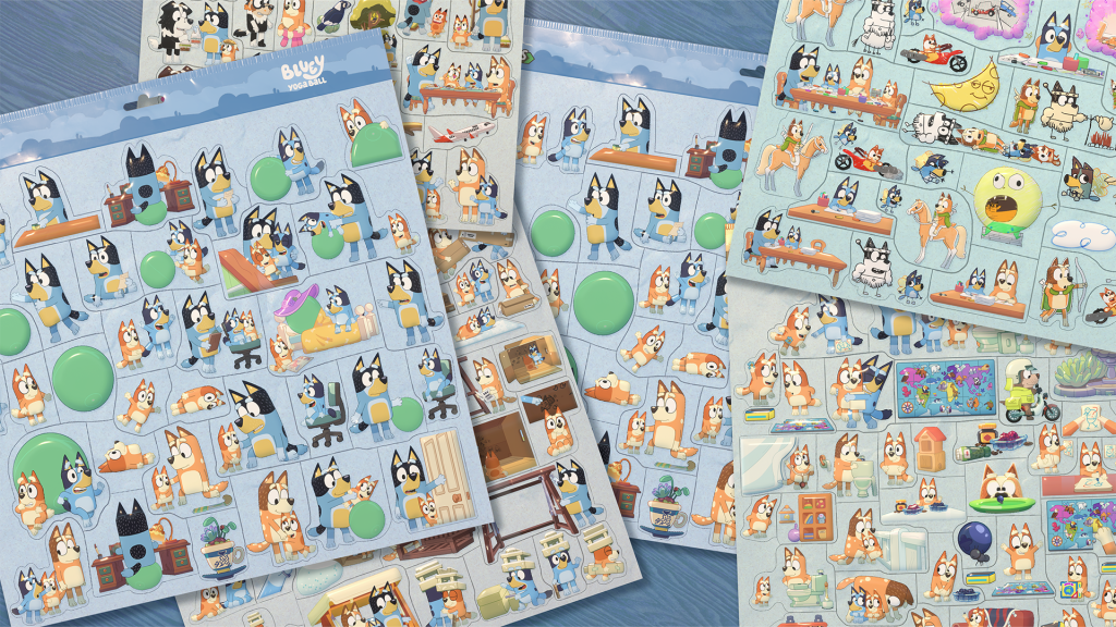 Several Bluey Puffies sheets spread across a table, featuring characters, scenes and puzzle designs from different episodes.
